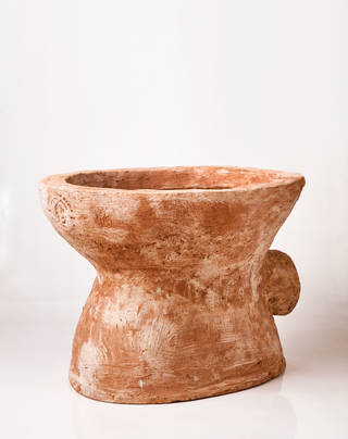 Teracotta looking toilet bowl. Orange colour