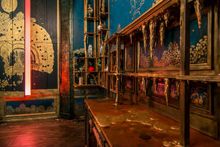 View of the gold stalactites inside Darren Waterson's Filthy Lucre installation.