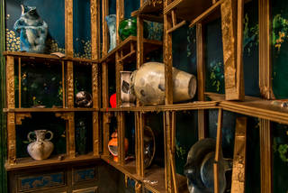 Detail view of the broken pots and walls inside Darren Waterson's 'Filthy Lucre' installation.