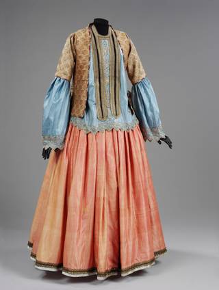 Woman's sky blue silk blouse, jacket, and coral coloured silk skirt