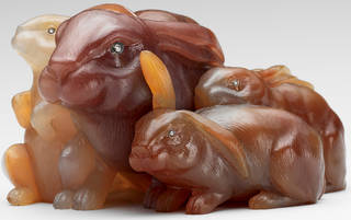 Four rabbits carved in brown and orange coloured agate with gemstone eyes
