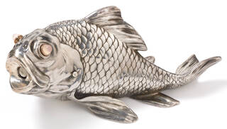 Silver cigar cutter in the shape of a carp