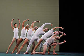 Male dancers in white underwear and vests