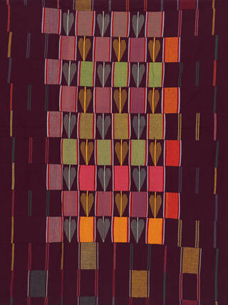 Textile made up of 19 lengths of strip woven cotton each approximately 10cm wide. A portion of the centre has supplementary weft float patterns depicting leaves. It is burgundy, yellow, green, orange and grey in colour