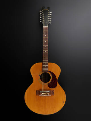 acoustic guitar on a black and grey background