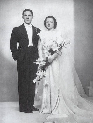 Black and white photograph of a couple on their wedding day