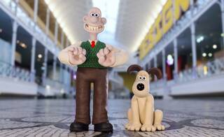 Black line drawings of Shaun the Sheep on white paper background